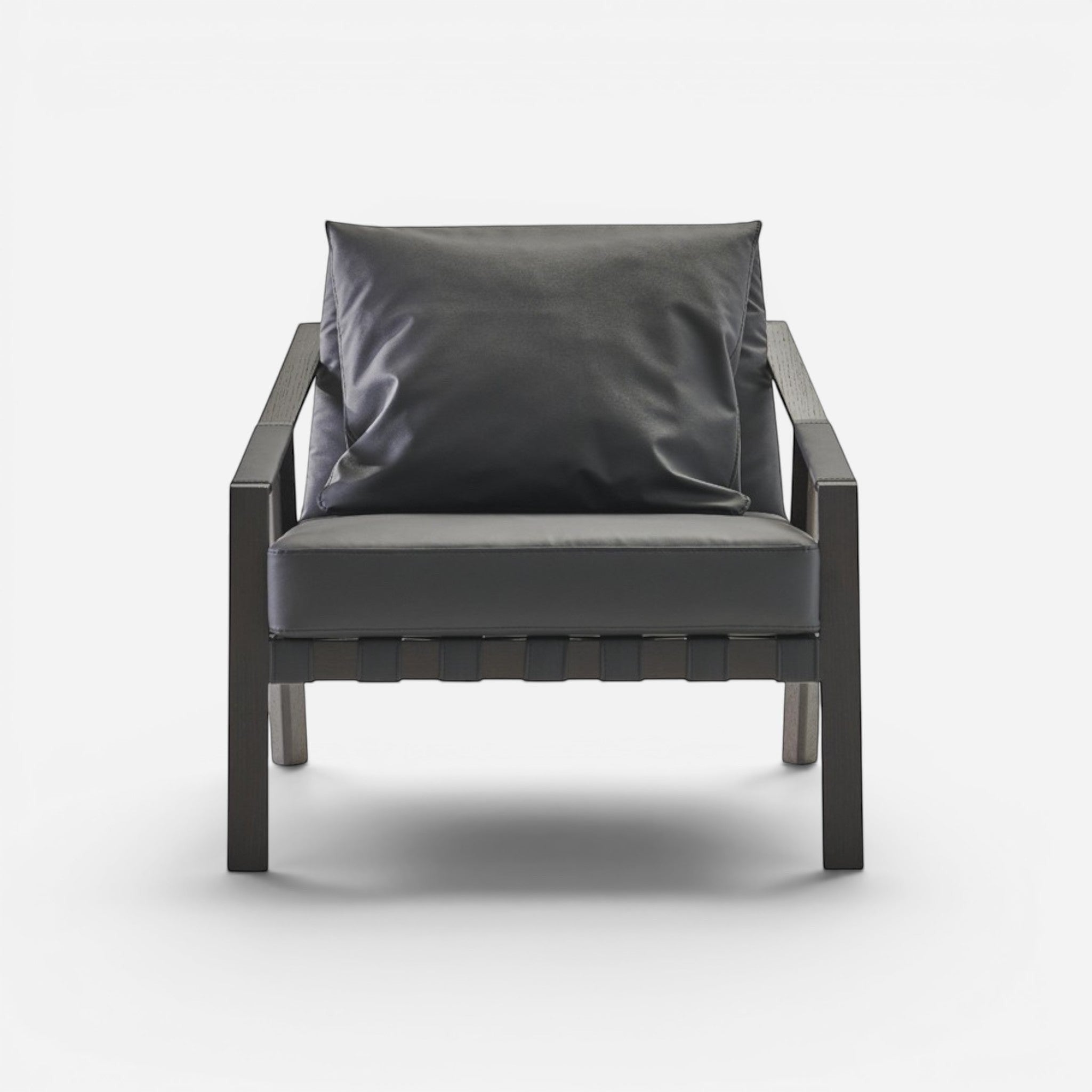 Addo Shop Lares lounge chair with dark grey faux leather upholstery and oak wood frame. Modern armchair.