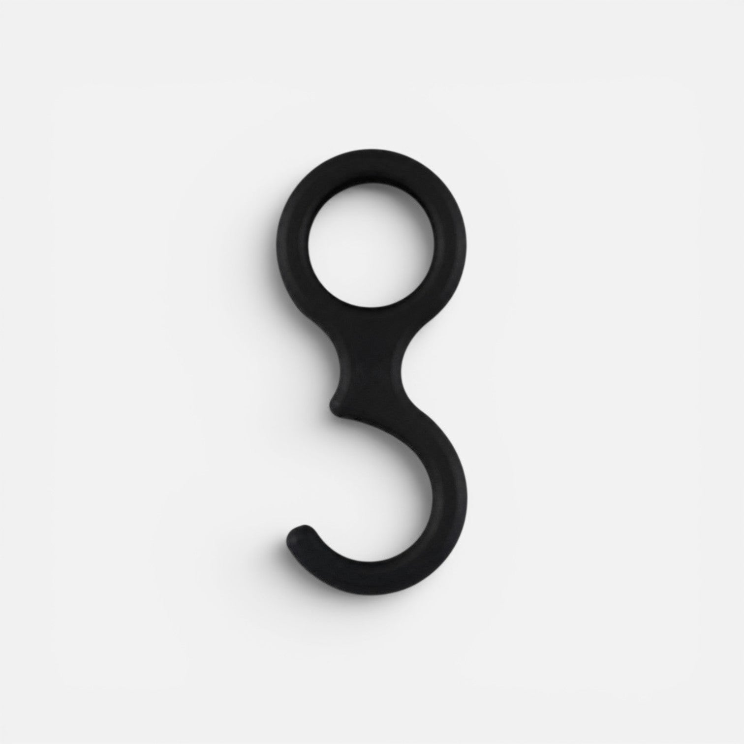 Addo Shop Ometto Hook, a black plastic hook with a circular top and a curved bottom.