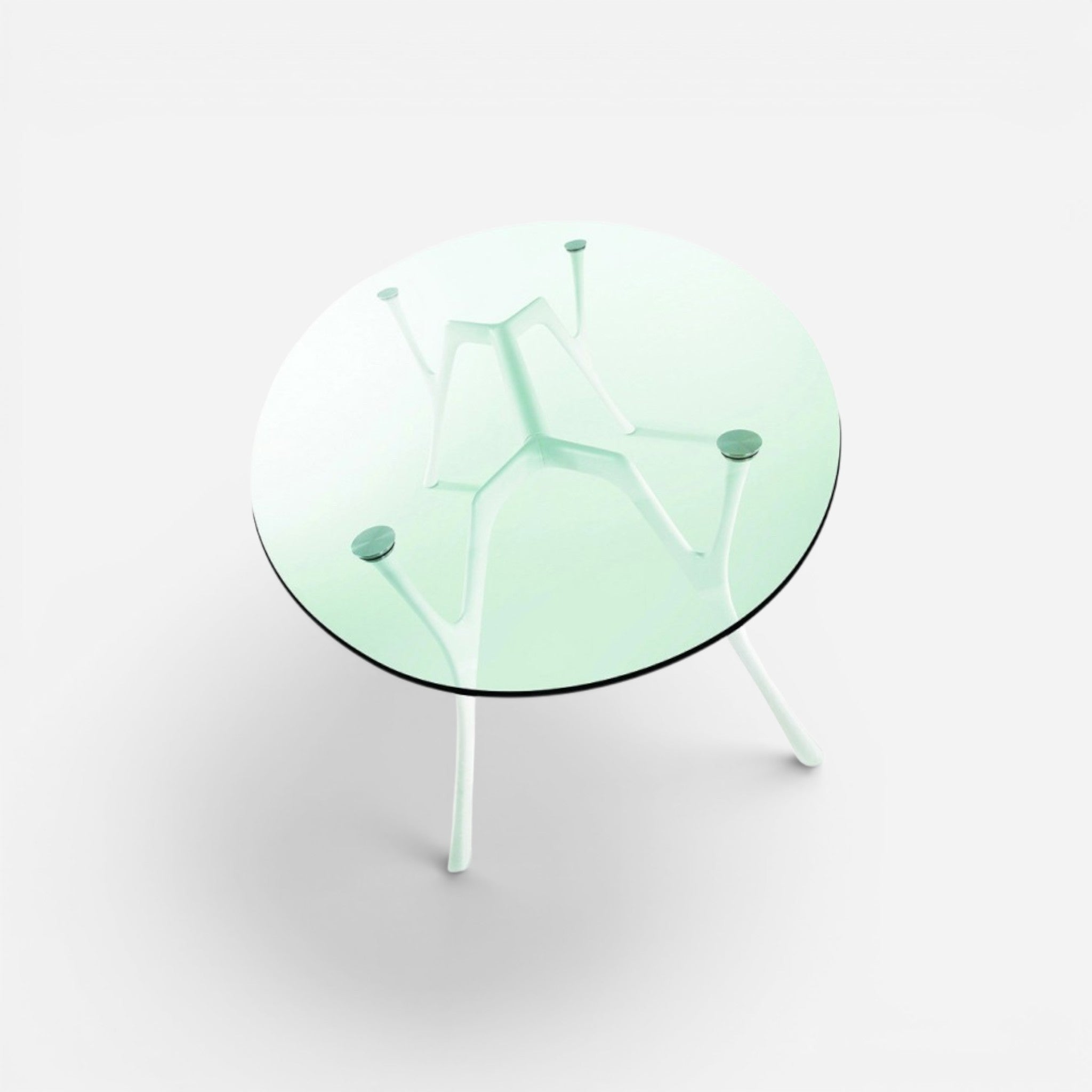 Addo Shop Pegaso round glass top dining table with white sculptural base and legs.