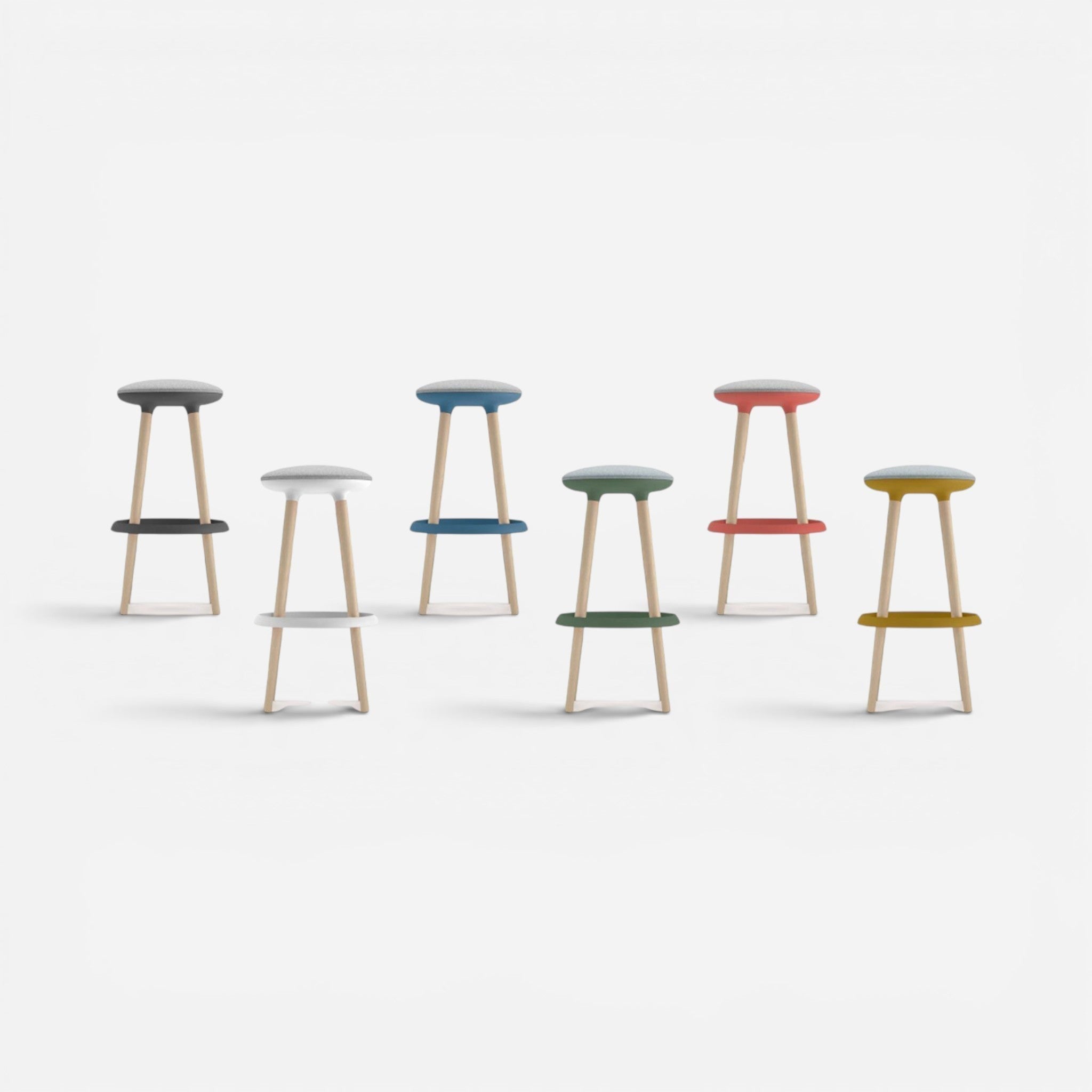 Addo Shop Pin bar stool with wood legs, available in grey, white, blue, green, red, and yellow fabric seats and footrests.