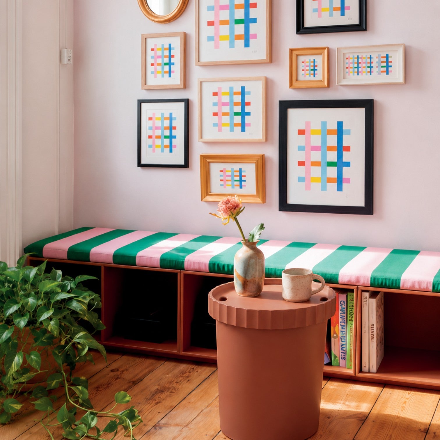 Addo Shop Raffles System Side Table in terracotta with fluted detail, holding a mug and vase.