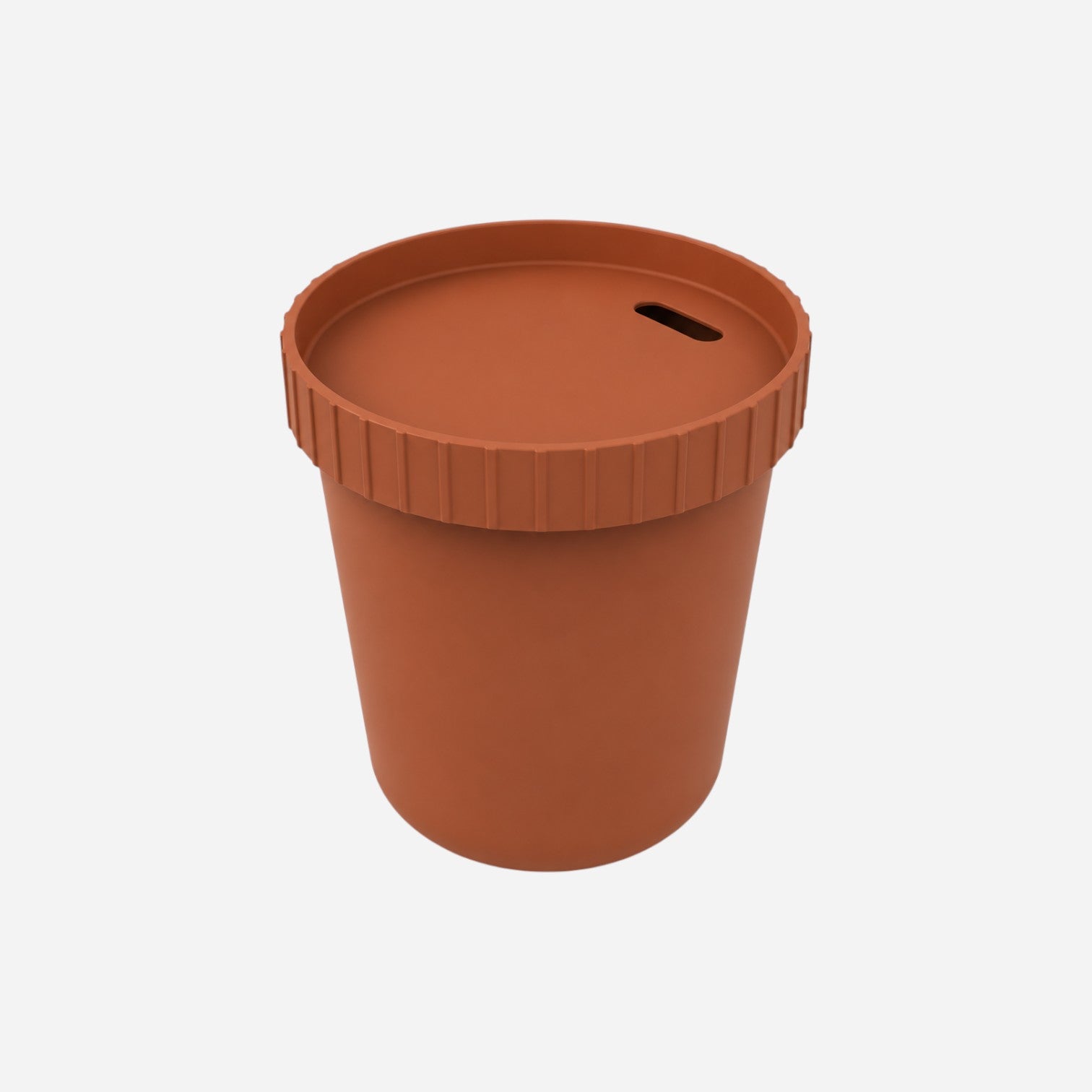 Addo Shop Raffles System Side Table in terracotta, a cylindrical modern accent table with a ribbed lid and slot.
