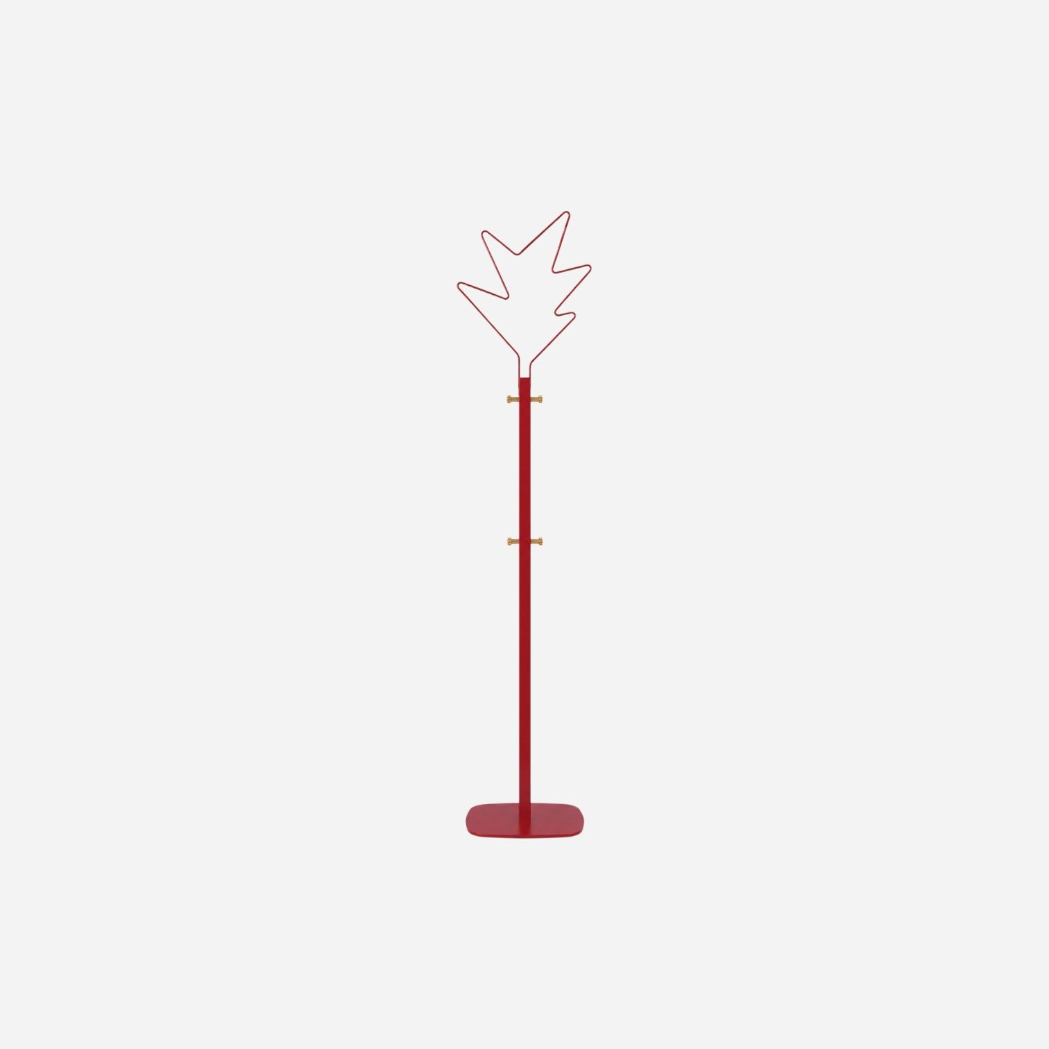 Addo Shop Stella red metal coat stand with starburst top and brass hooks, for office or design spaces.