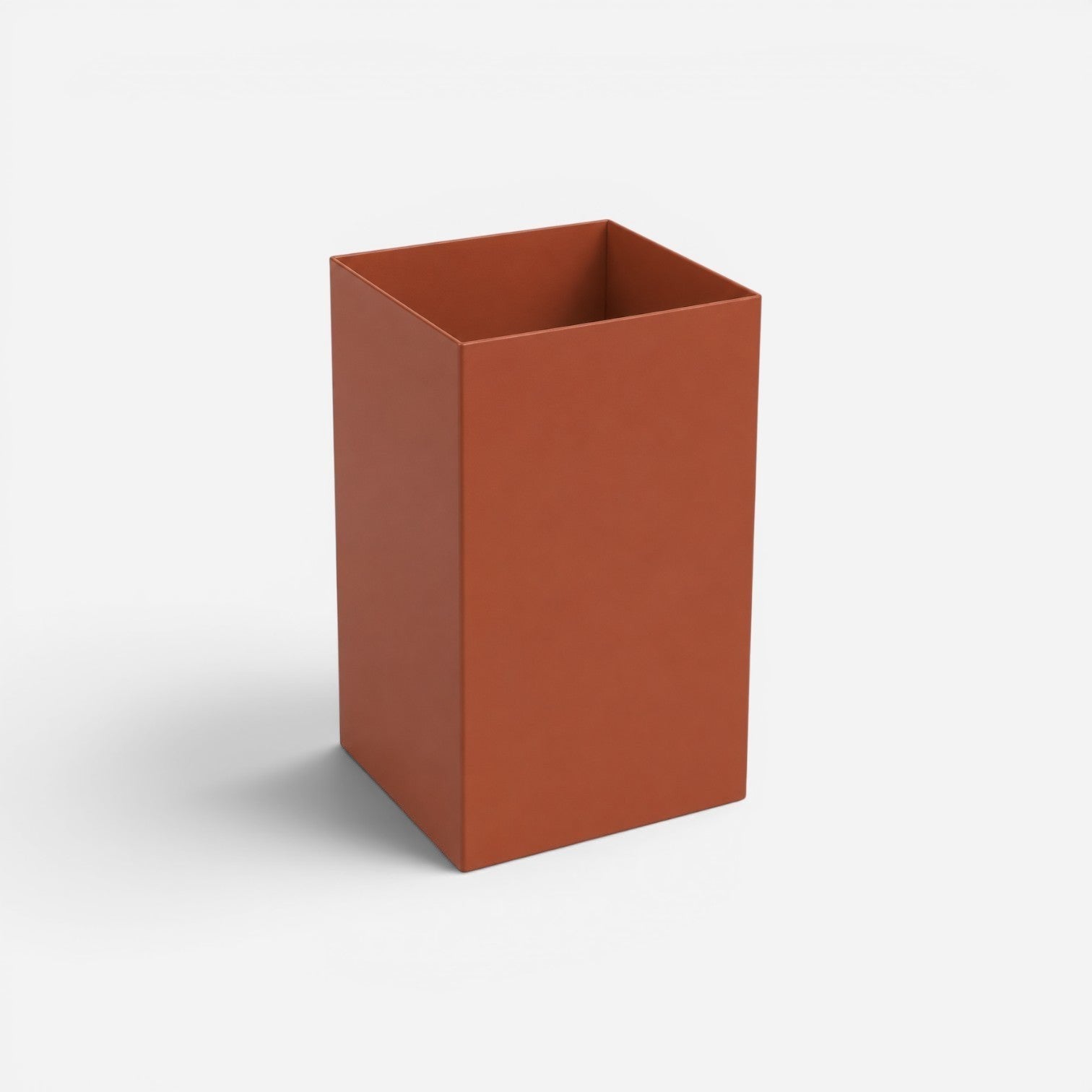 Addo Shop 13L rectangular waste bin in a matte terracotta finish. Modern design for home or office.