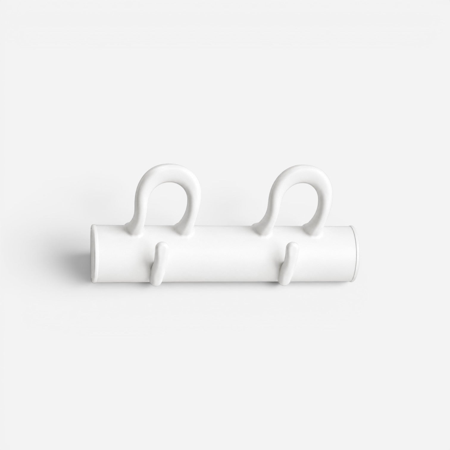 Addo Shop white wall mounted coat rack with 4 curved hooks for coats, hats, and bags. Modern minimalist design.